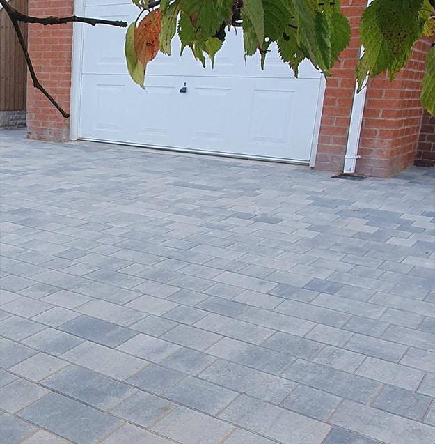 Modern block paved driveway outside residential property