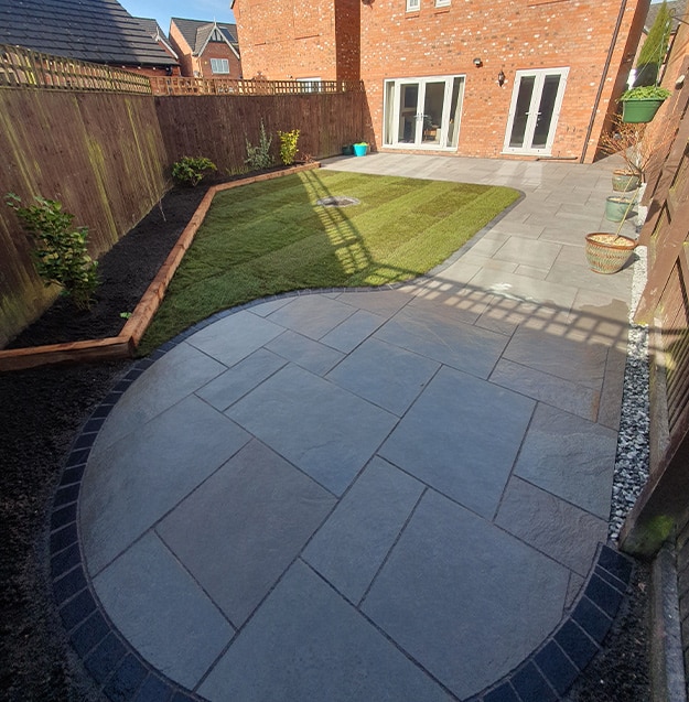 Landscaping installation with lawn, pathway, and decorative features