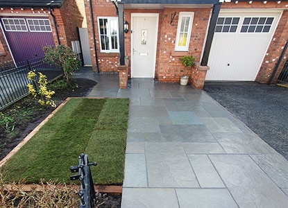 Professional front garden paving with durable stone slabs